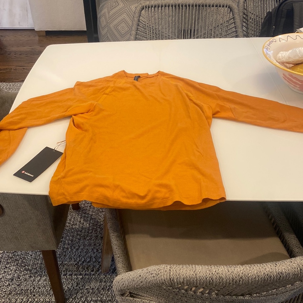 I am selling a orange long sleeve lulu lemon top